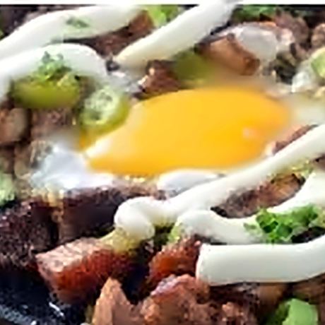 Sizzling sisig with egg